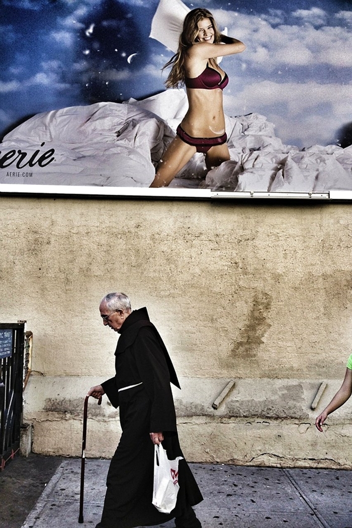 zonya-priest-walks-by-a-risqu-advertisement-in-this-photo-by-emanual-faria-of-portugal