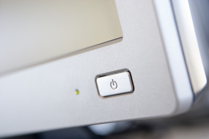 Shot of a power button on a computer monitor