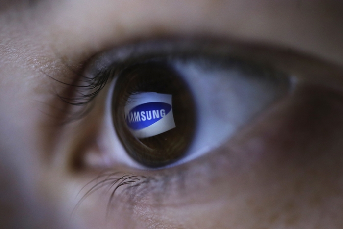 Picture illustration shows Samsung's logo reflected in a person's eye, in central Bosnian town of Zenica