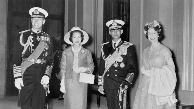 The King with his queen, Sirikit, were met by the Queen and Duke of Edinburgh
