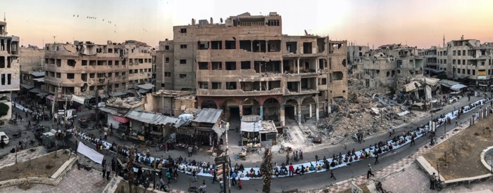 Iftar on a destroyed street in Douma